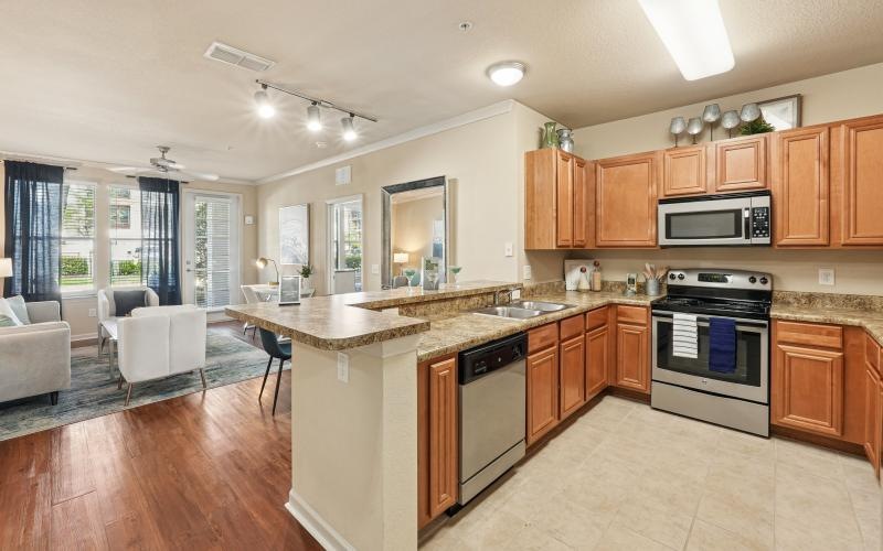 a kitchen with wooden cabinets