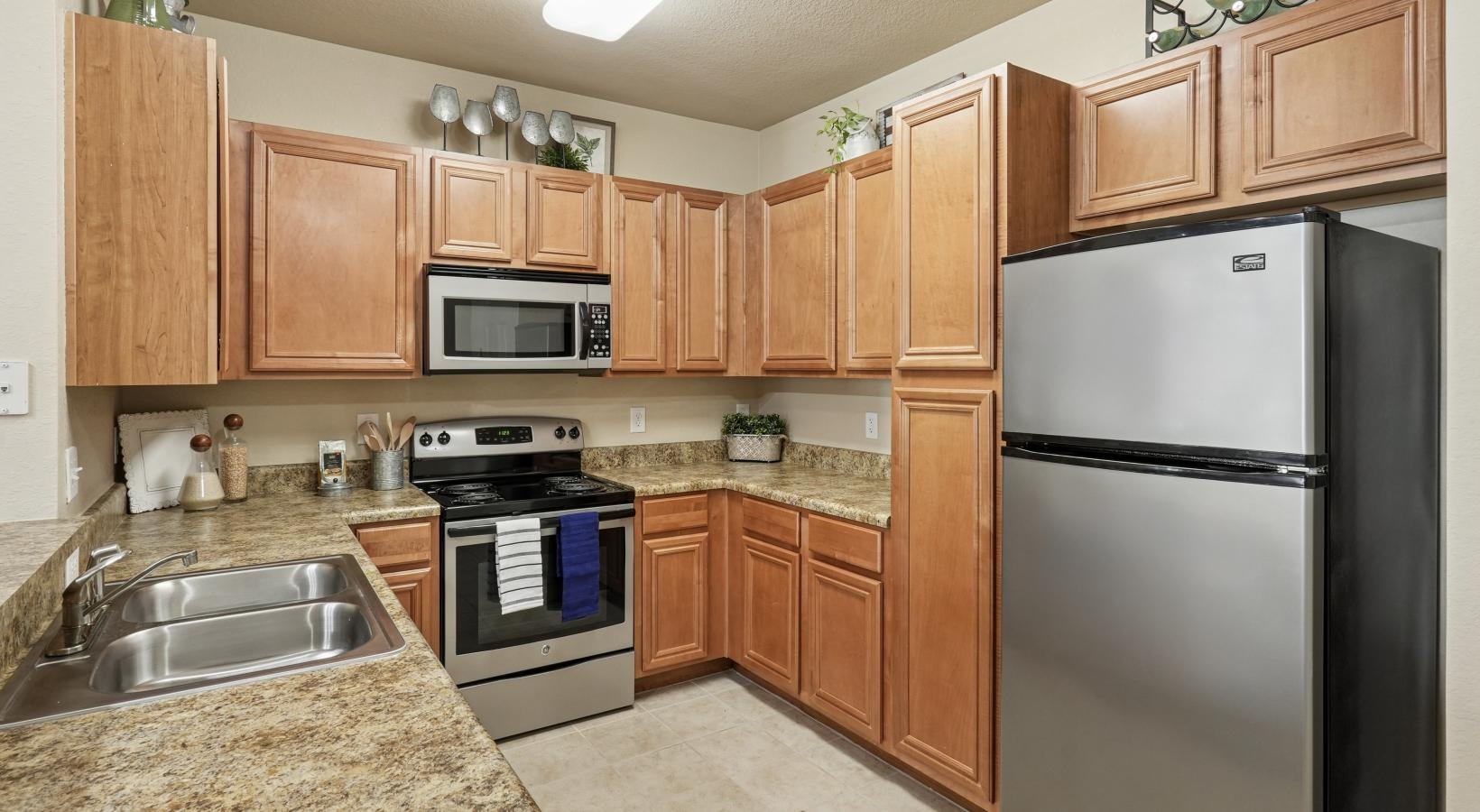 a kitchen with wooden cabinets