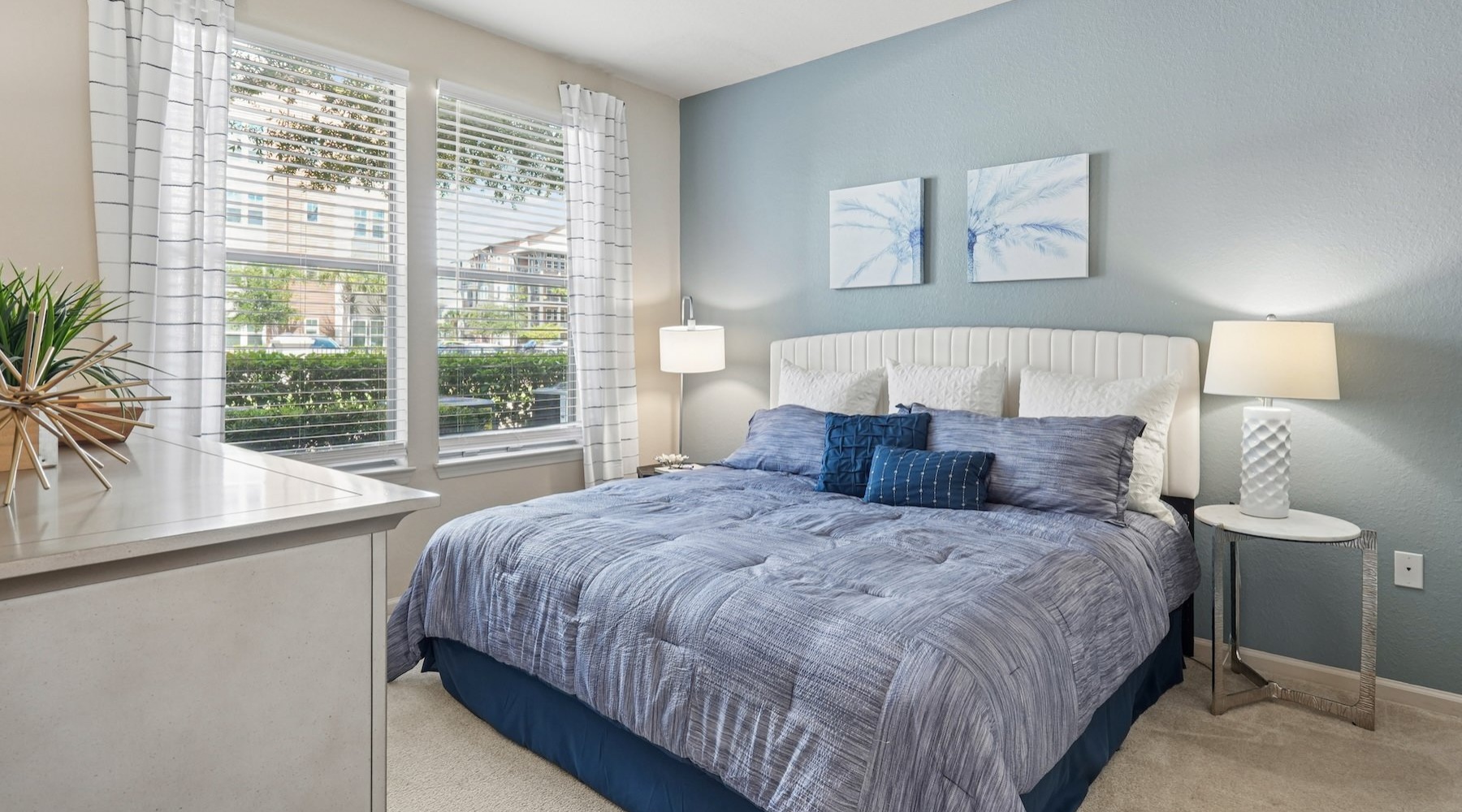 a bedroom with a bed and two nightstands