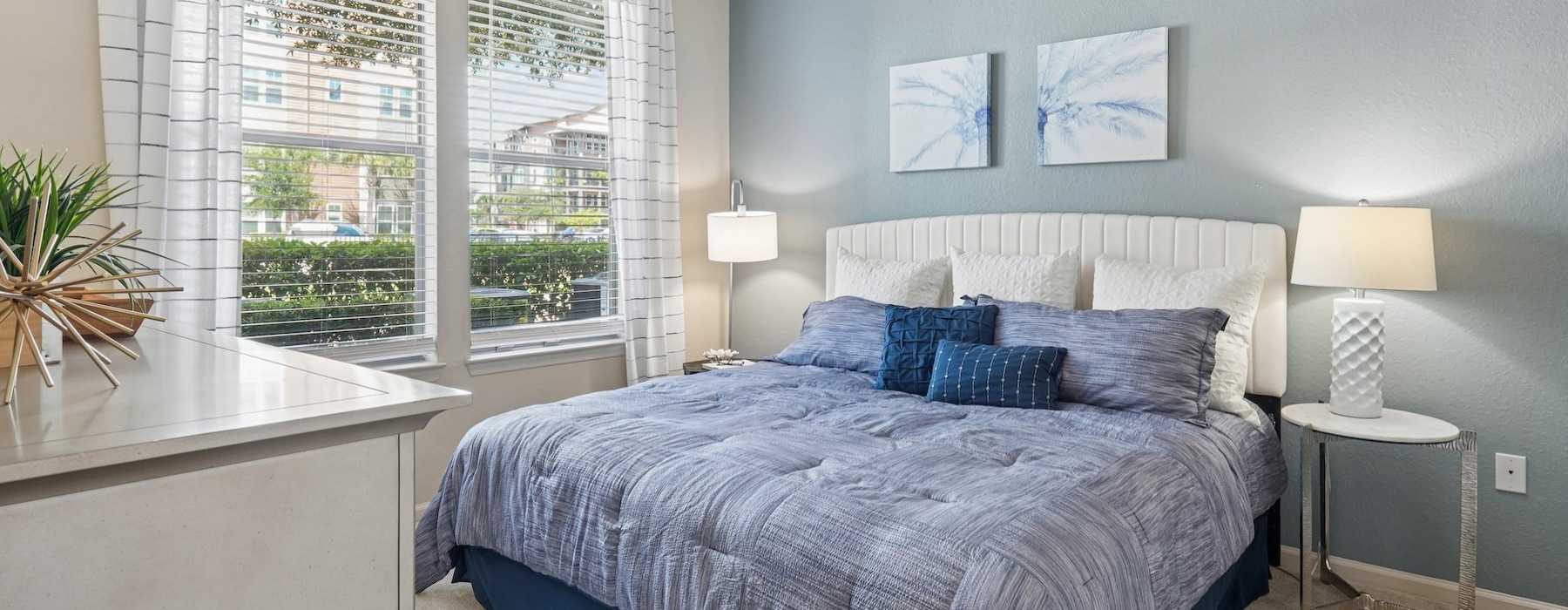 a bedroom with a bed and two nightstands