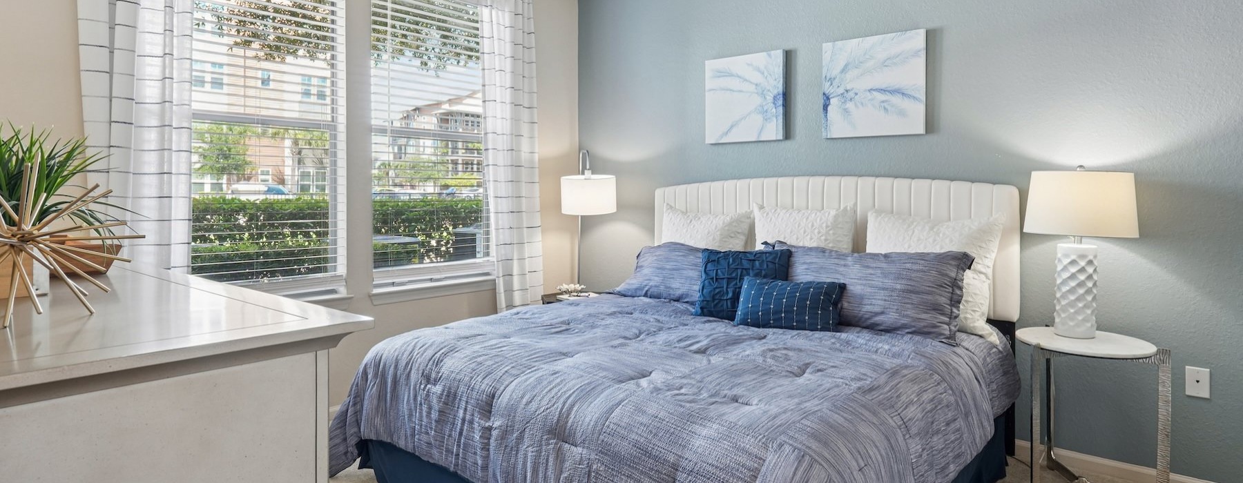a bedroom with a bed and two nightstands